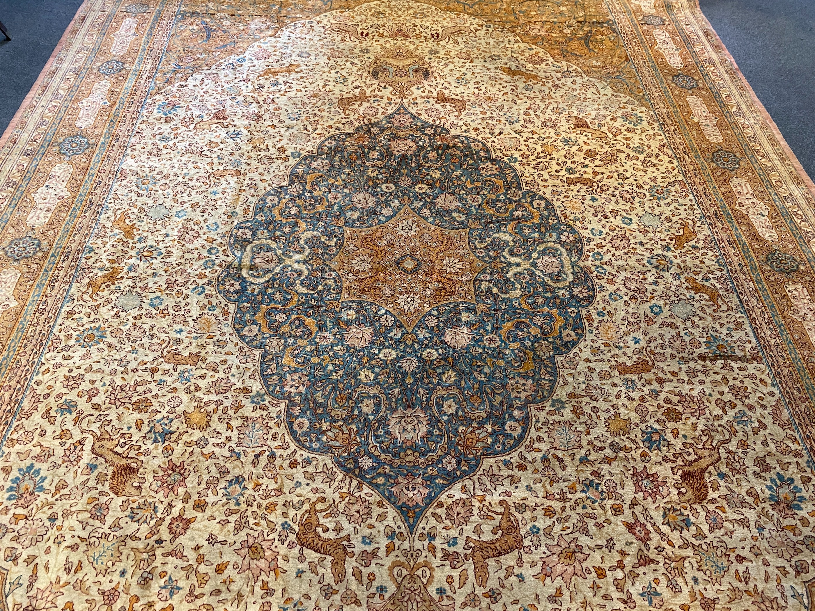 An early 20th century Tabriz ivory ground carpet, 528 x 348cm